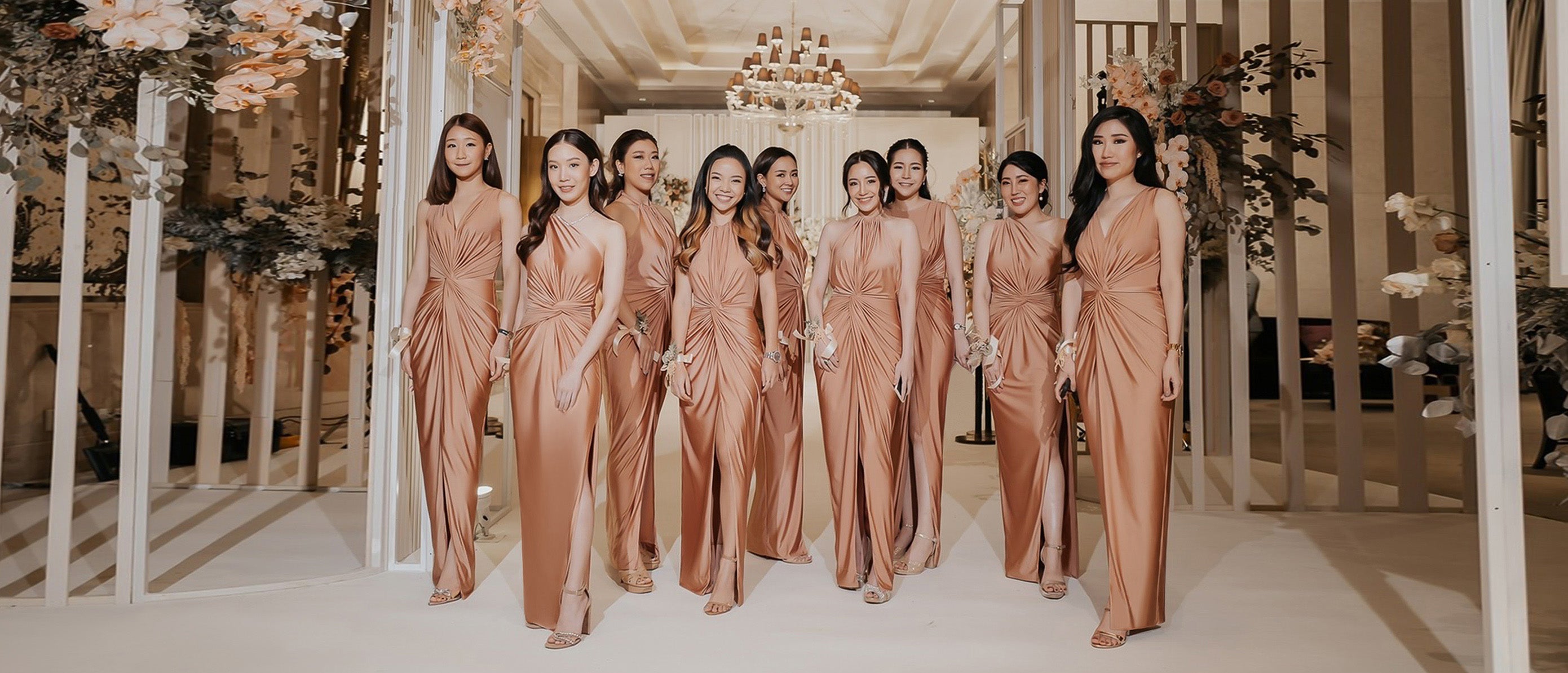 a group of bridesmaid wearing rose gold evening dresses