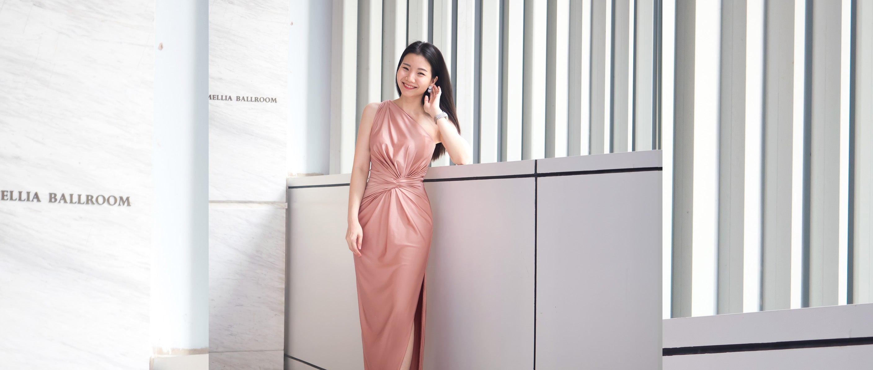 model wearing a dusty rose one shoulder evening dress