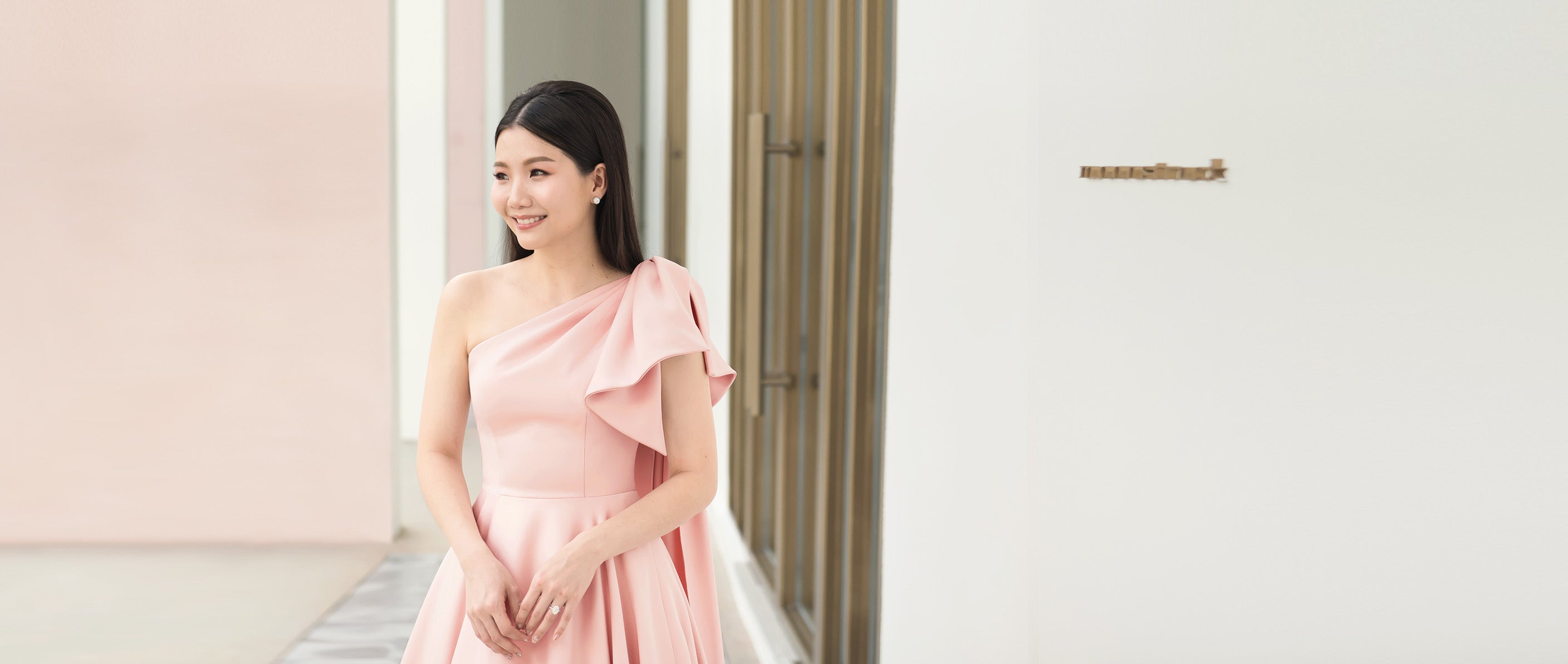 model in light pink minimal bride wedding gown
