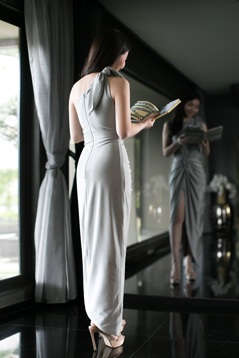 model in silver gray one-shoulder midi spandex evening dress