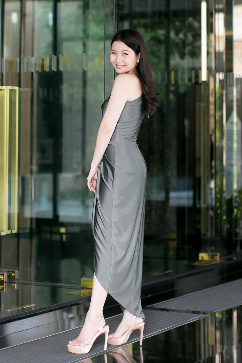 model in dark gray one-shoulder midi spandex evening dress