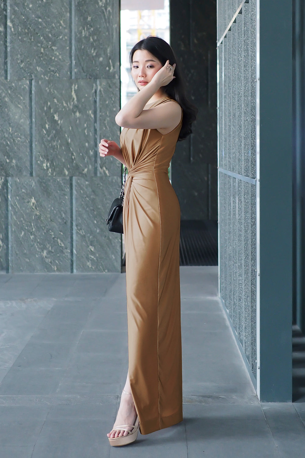 model in gold boat neck spandex evening dress