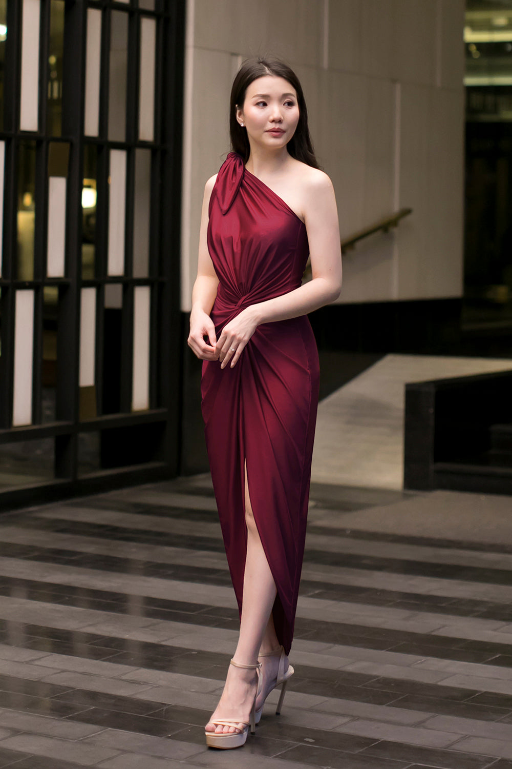 model in burgundy one-shoulder midi spandex bridesmaid dress