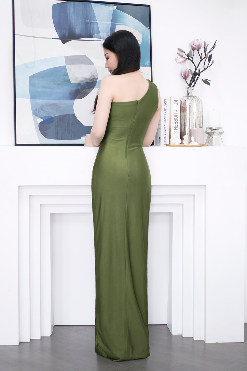 model in dark olive green one-shoulder with an asymmetric column skirt spandex evening dress