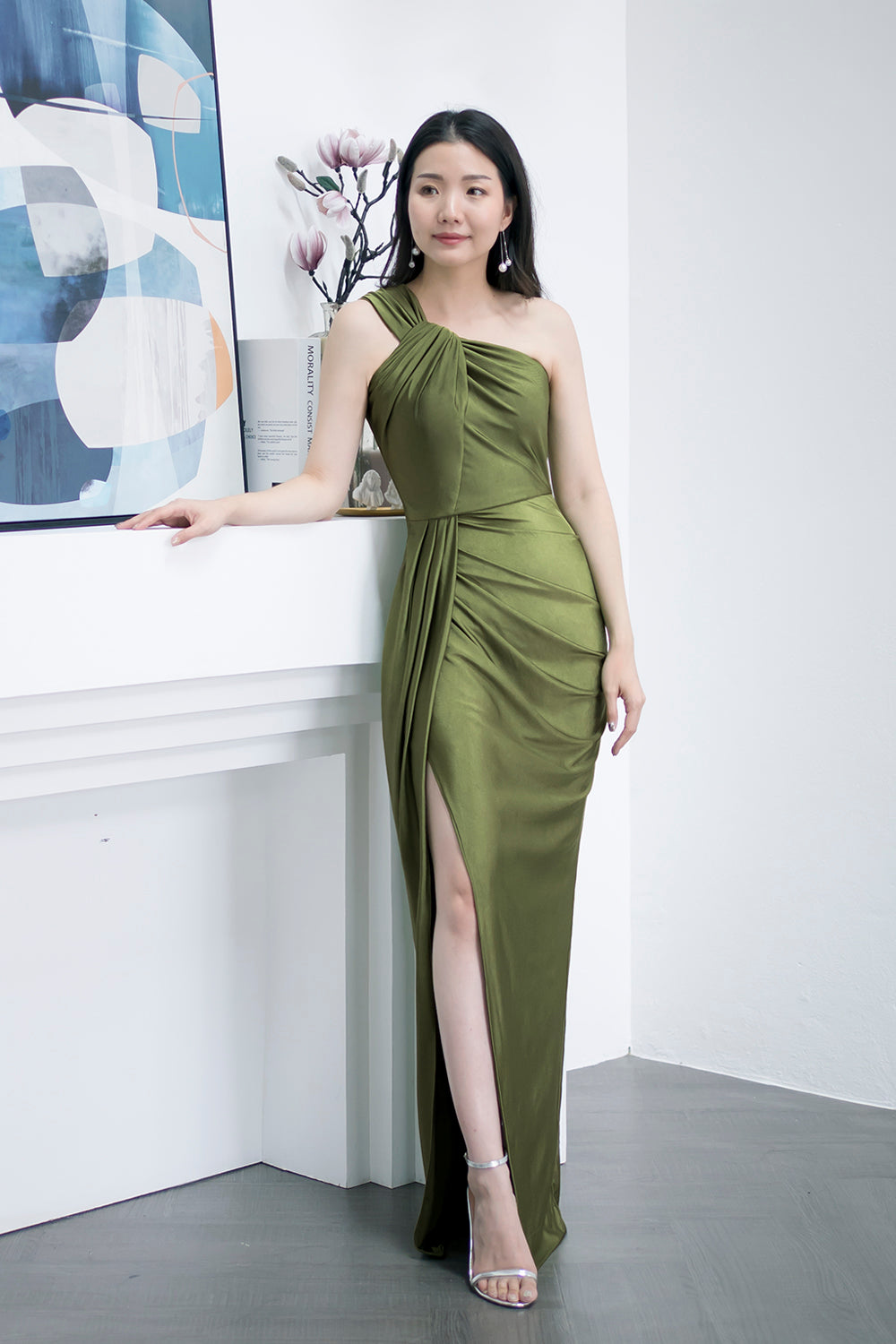 model in dark olive green one-shoulder with an asymmetric column skirt spandex evening dress