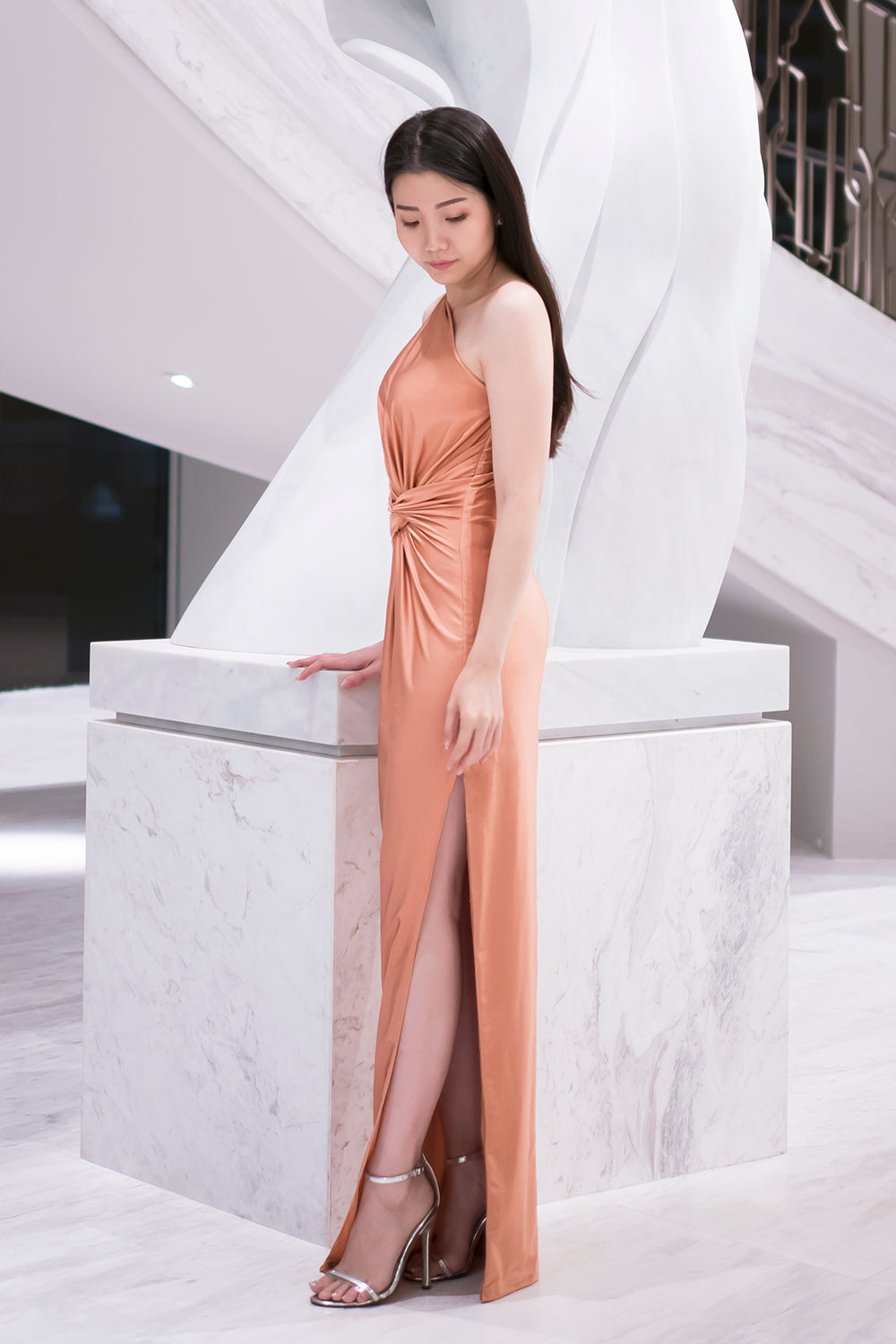 model in rose gold one shoulder spandex evening dress