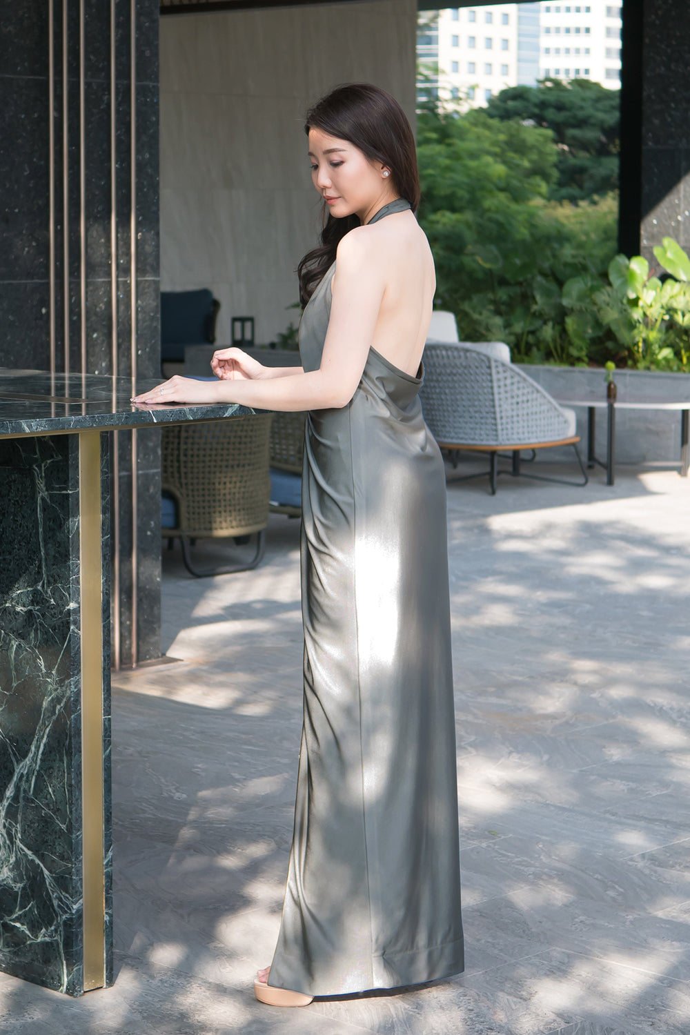 model in dark gray halter neck open back spandex event dress