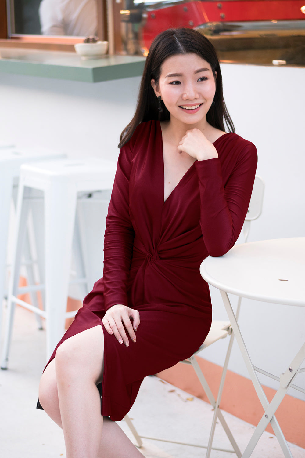 model in burgundy long sleeve v neck spandex evening dress