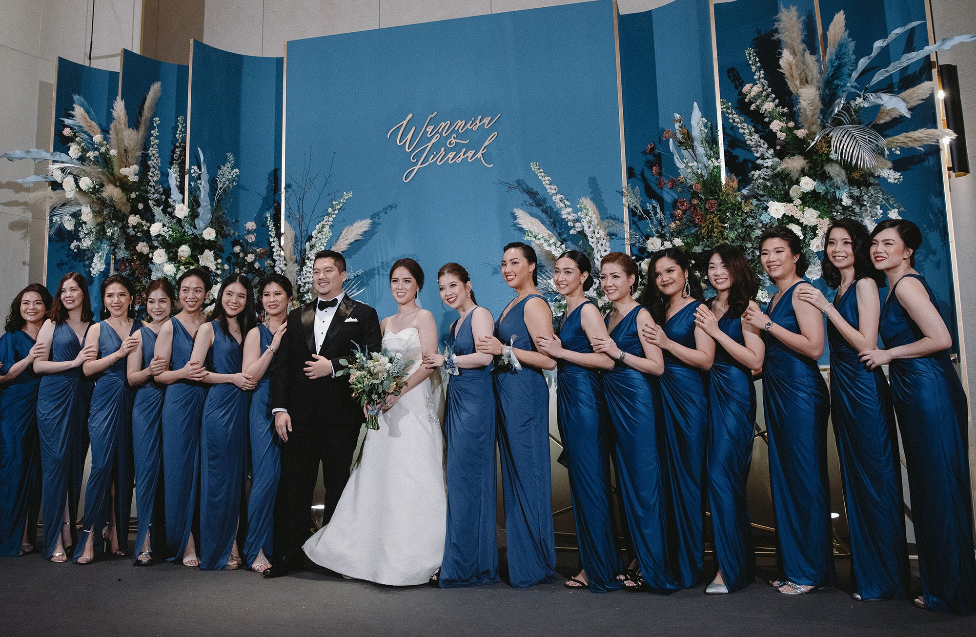 a group of bridesmaid wearing dark blue evening dresses