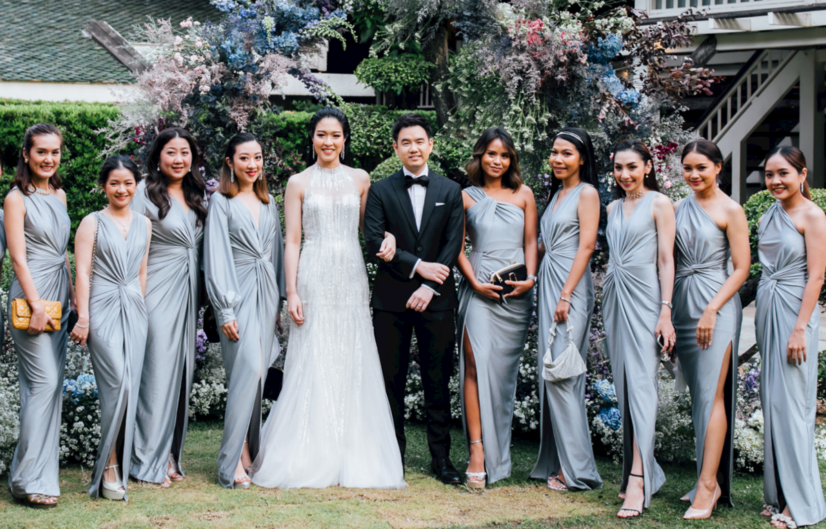 a group of bridesmaid wearing silver gray evening dresses