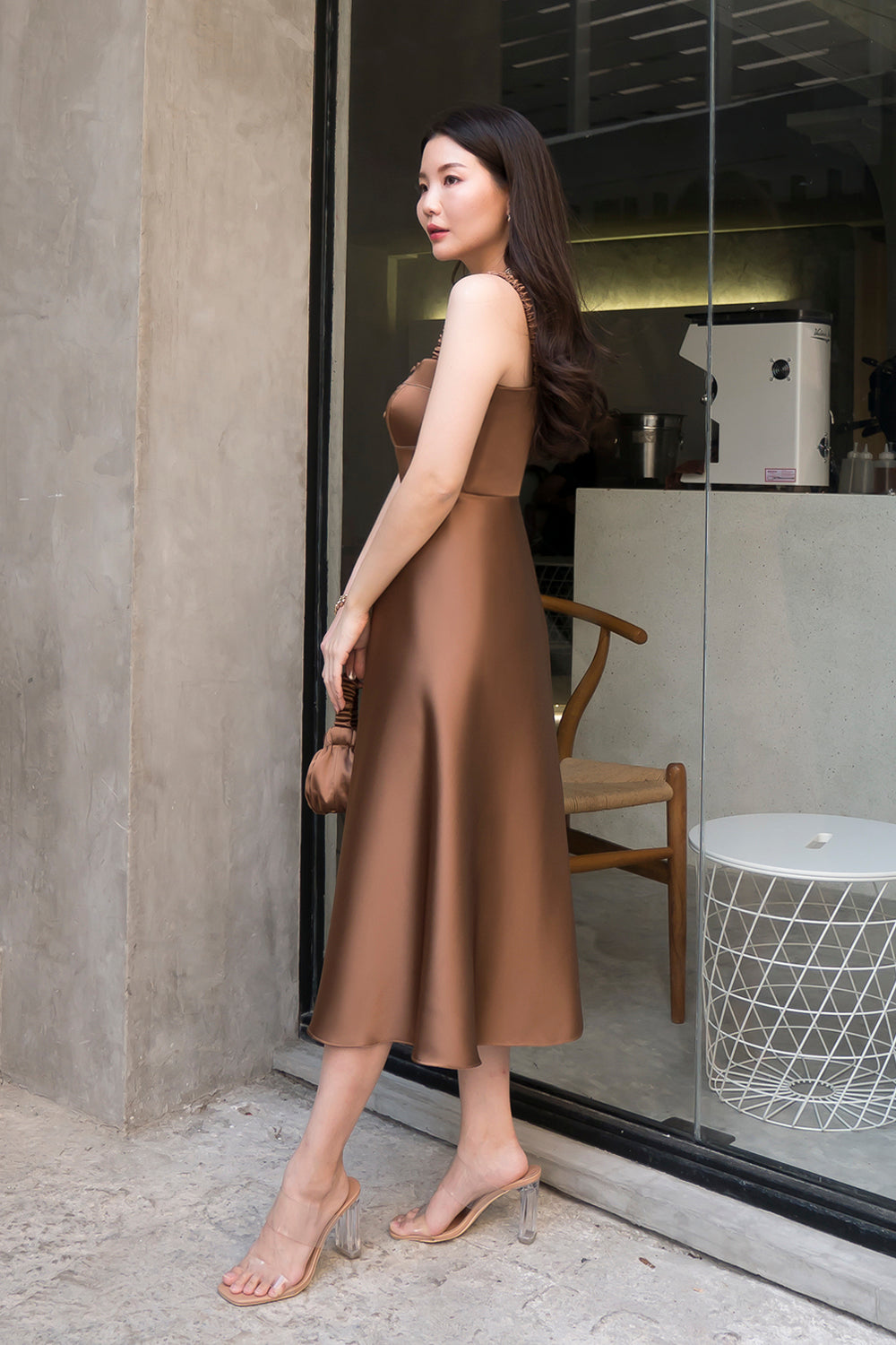 model wearing a brown bustier-inspired dress