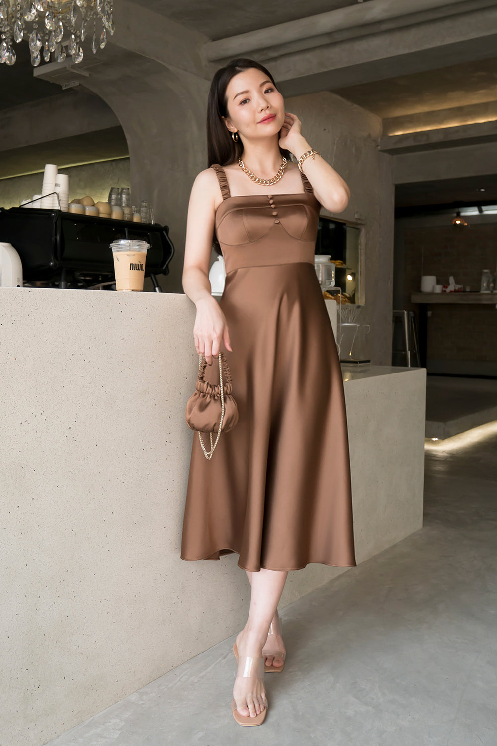 model wearing a brown bustier-inspired midi dress