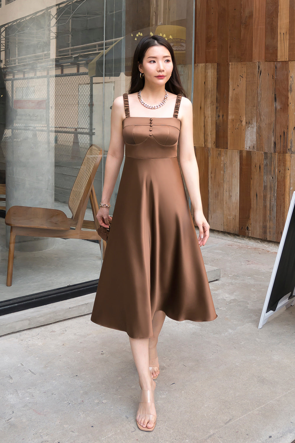 model wearing a brown bustier-inspired A-line dress