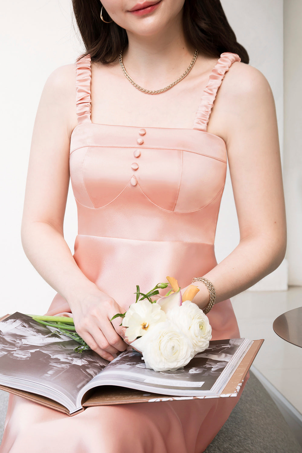 model wearing a pink bustier-inspired dress