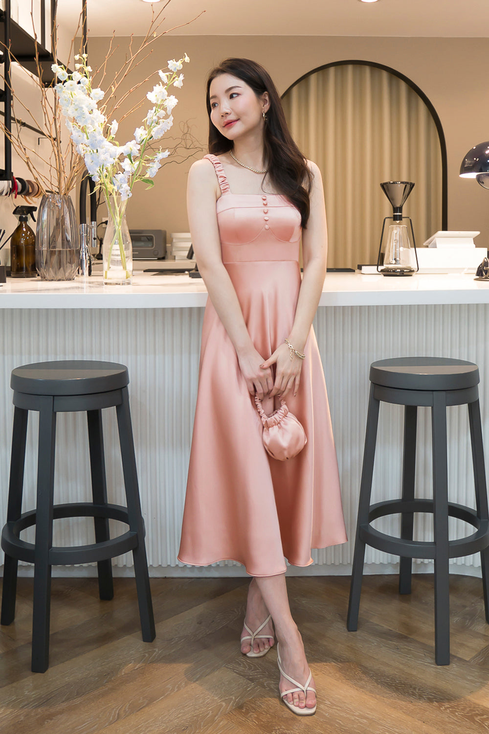 model wearing a pink bustier-inspired summer dress