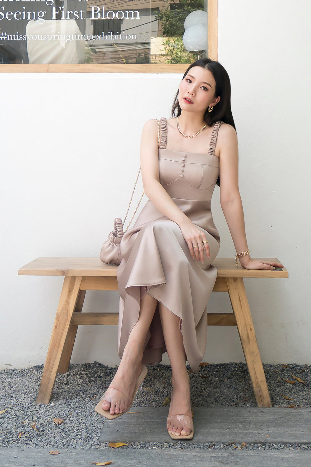 model wearing a light taupe bustier-inspired summer dress