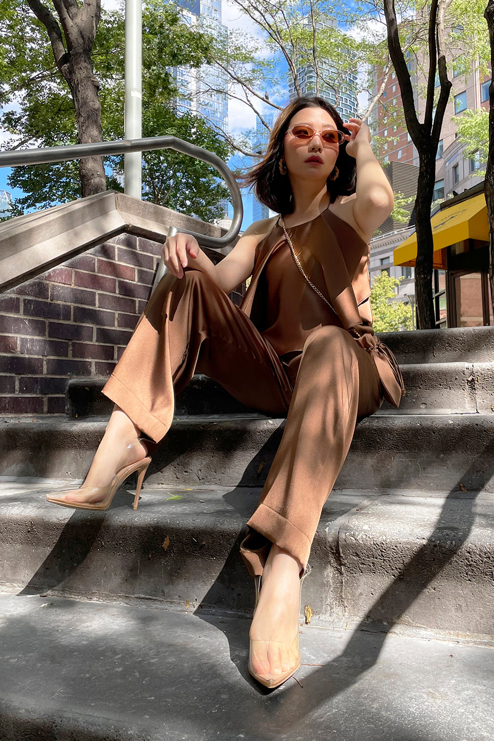 model wearing a brown halter neck top with matching high-waisted pants