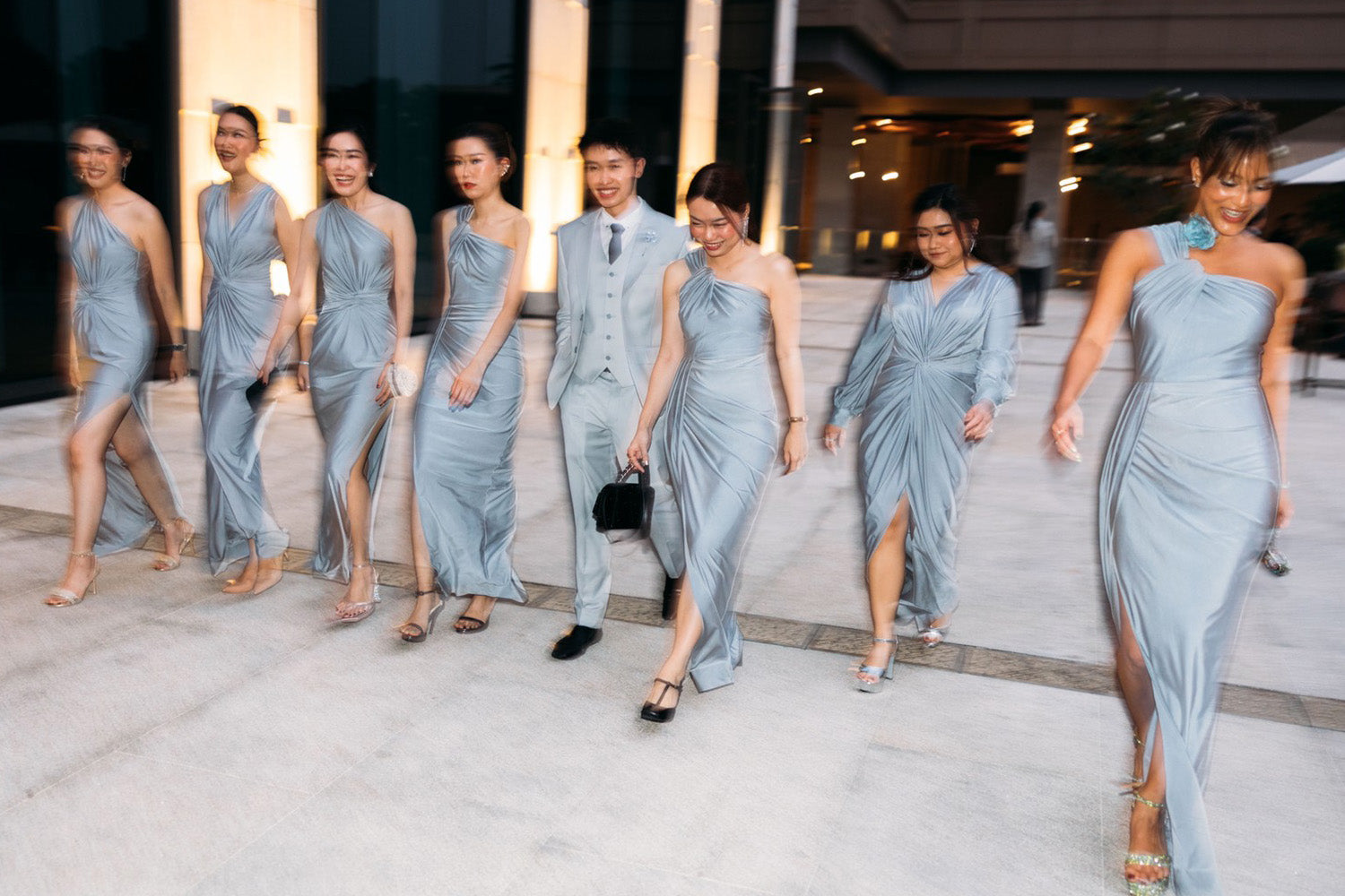 a group of bridesmaid wearing silver gray evening dress