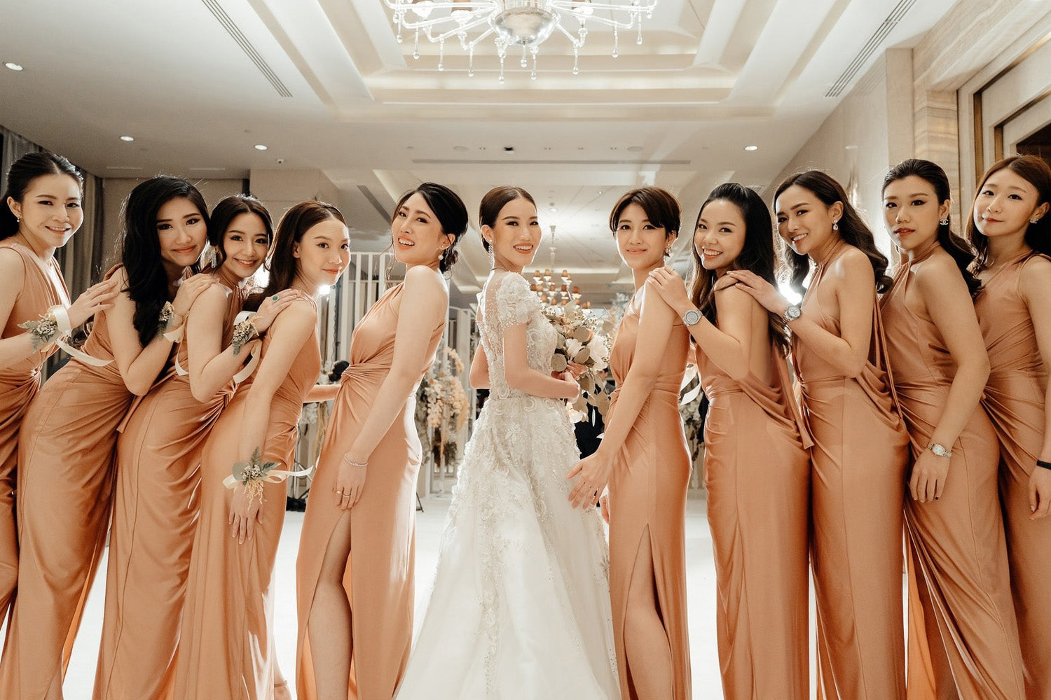 a group of bridesmaid wearing rose gold evening dress