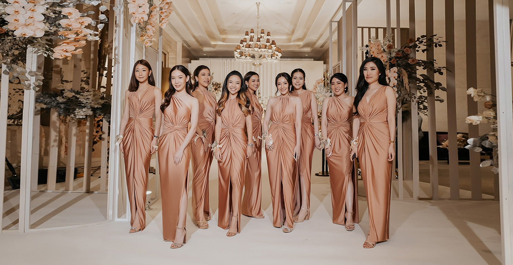 a group of bridesmaid wearing rose gold evening dresses