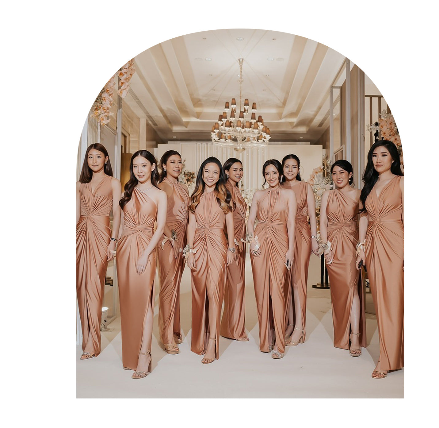 a group of bridesmaid wearing rose gold evening dresses