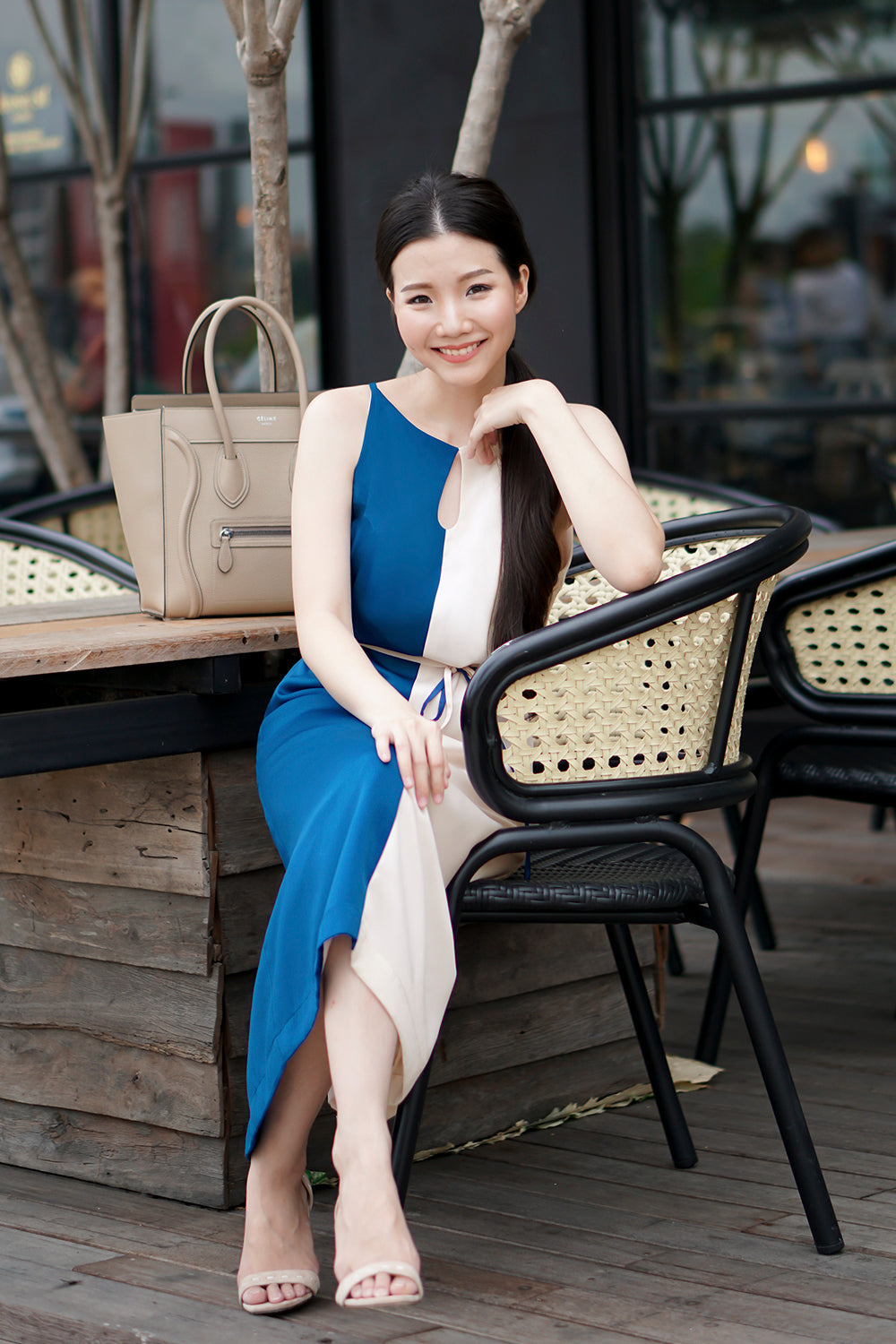 model wearing a blue cream color block summer dress