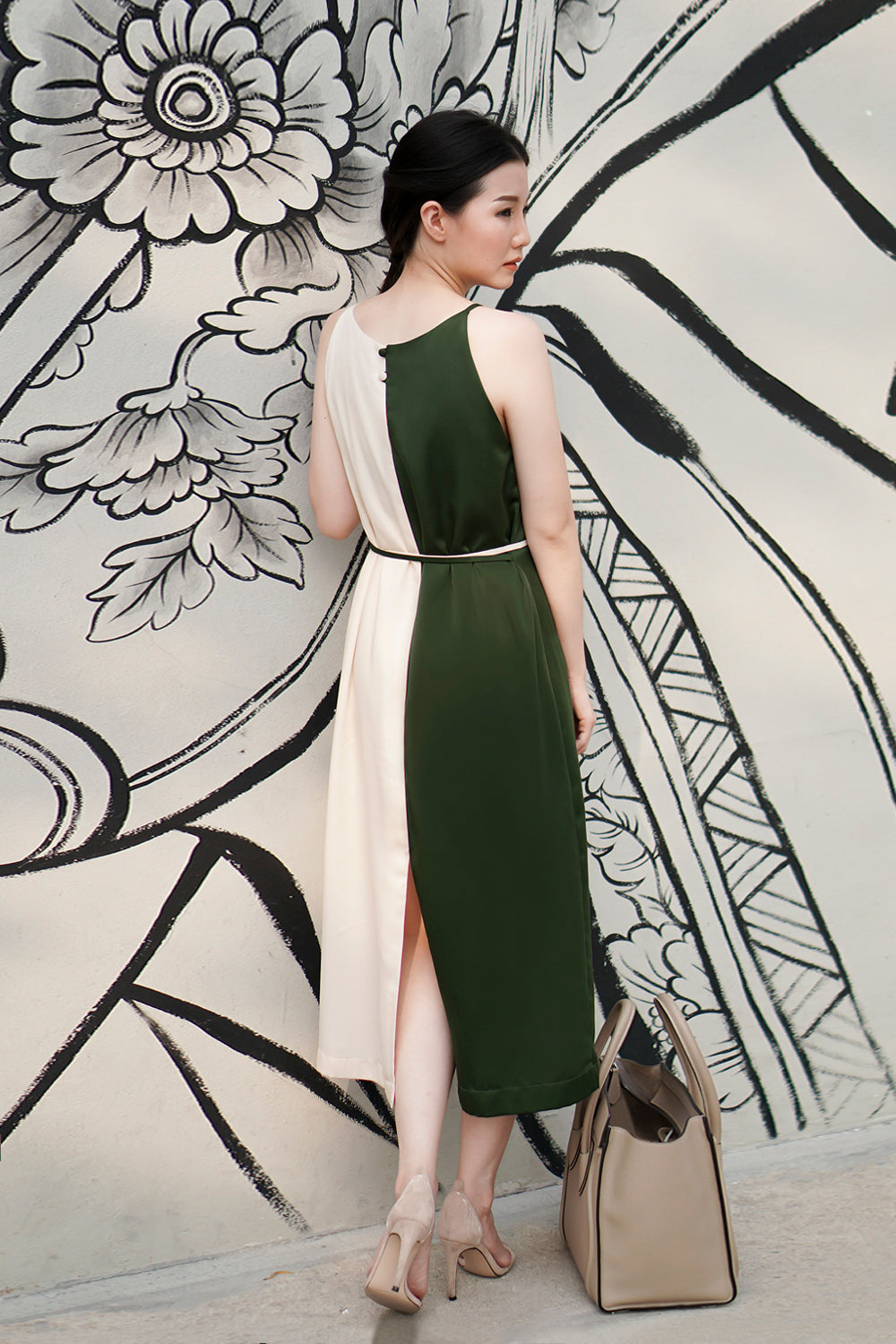 model wearing a green cream color block casual dress