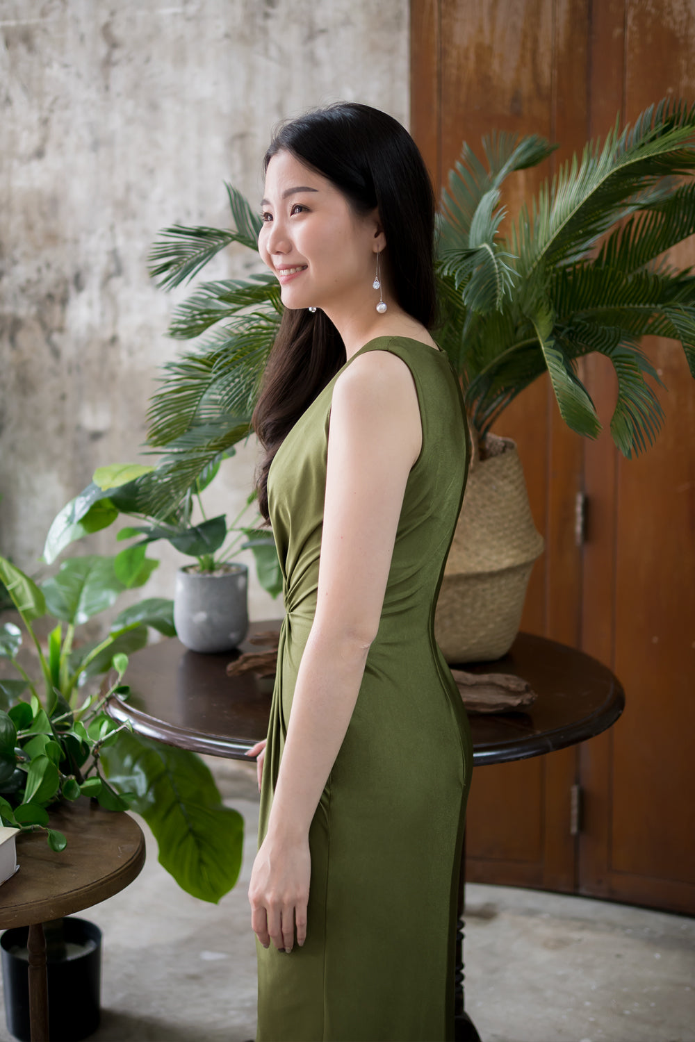 model in dark olive green sleeveless v neck spandex bridesmaid dress