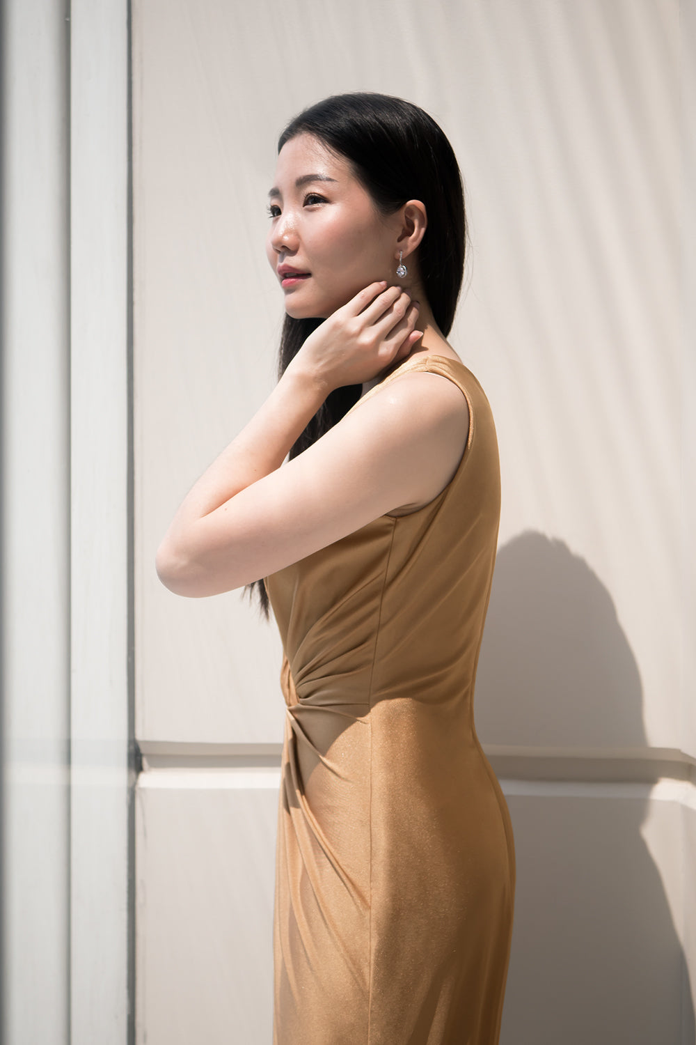 model in gold sleeveless v neck spandex evening dress